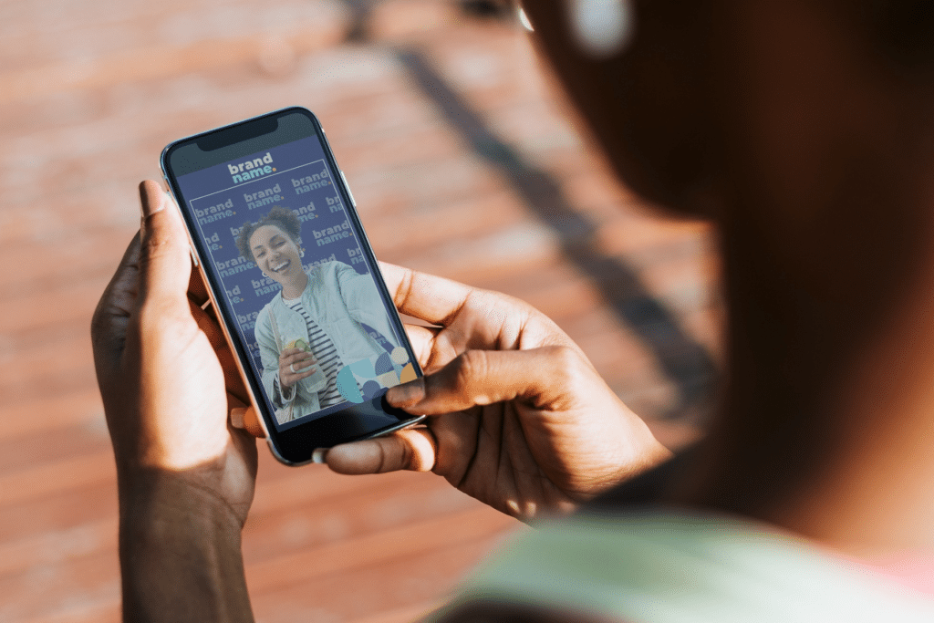 Mobile virtual photo booth experience showing a branded portrait capture inside a Lumen Activations branded scene