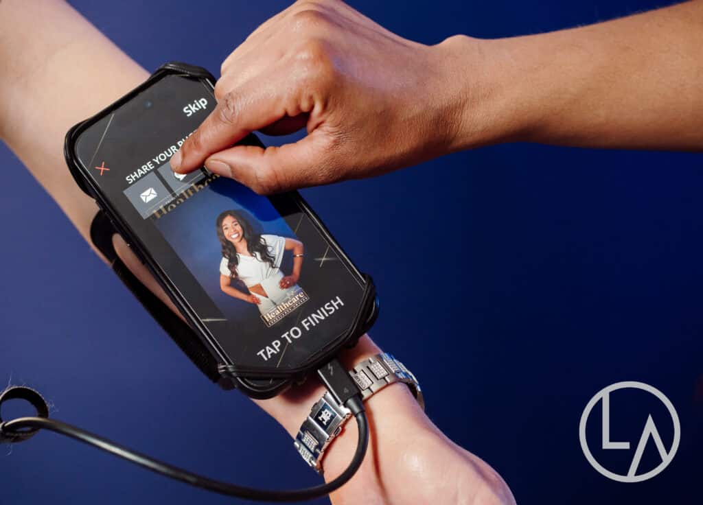 branded event photo delivered instantly Guest tapping to receive a branded event photo instantly on a wearable device