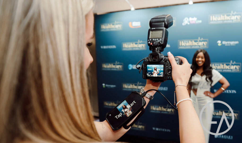 Lumen Activations photographer capturing a guest with instant roaming event photography at a corporate gala