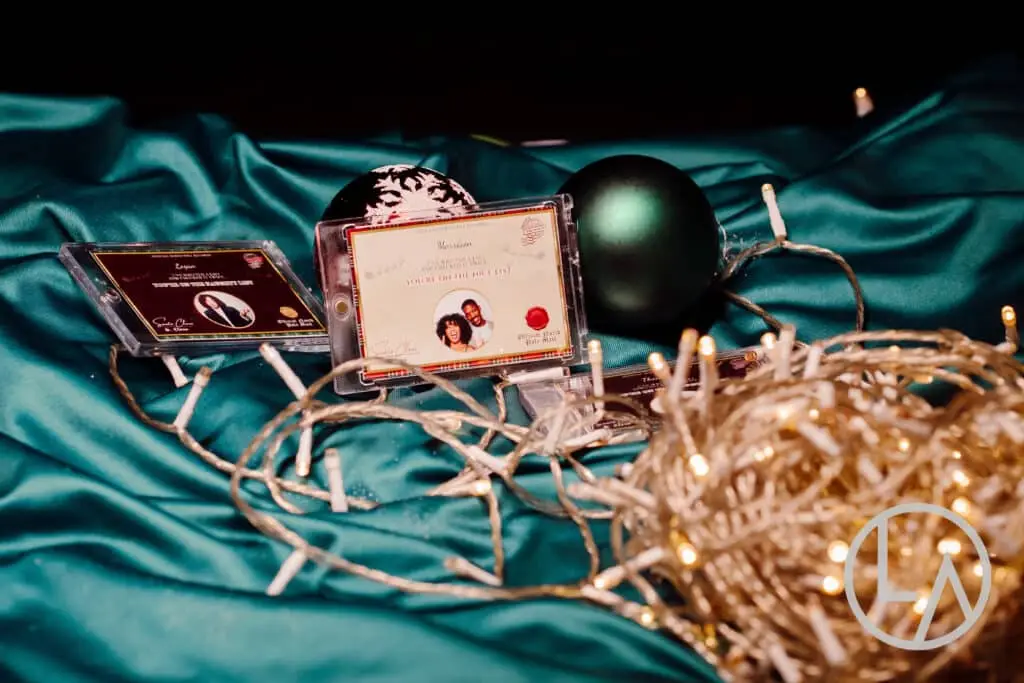Delighted corporate guest holding her personalized Holiday Bauble keepsake in Kansas City