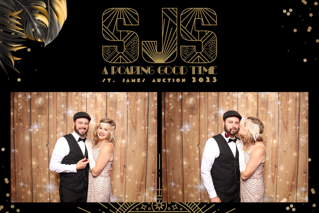 Guests in 1920s Gatsby-inspired attire pose against a rustic wood backdrop at the St. James Auction's "A Roaring Good Time," a branded photo experience by Lumen Activations.